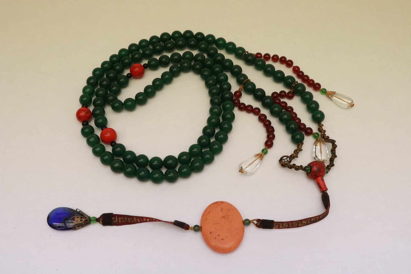 A long necklace with jade like beads: A long necklace (56.5"L) with jade like beads