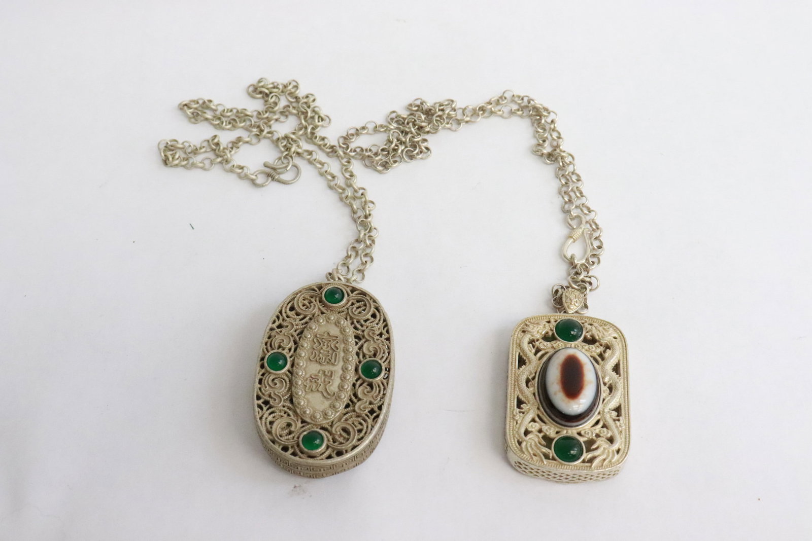2 scent bottles with necklace: 2 scent bottles with necklace, 2"x1.4"x0.7", 2.35"x1.6"x0.6"
