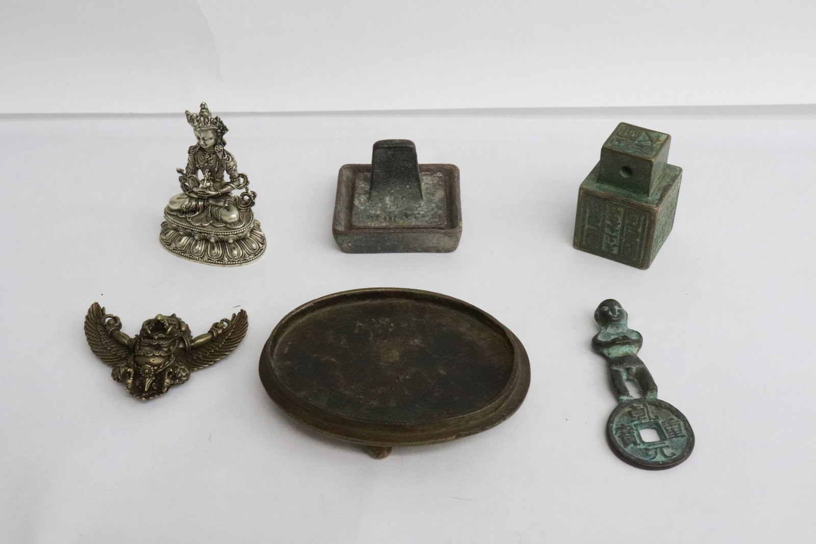 Lot of bronze articles; deity statue, seals, etc.: Lot of bronze articles; deity statue (2.35"H), seals (1.4"x1.5"x1.5", 1.75"x1.2"x1.2"), etc.
