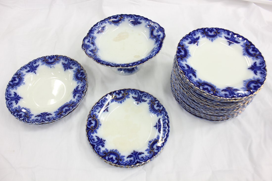 Partial set of Victorian flow blue china, total 27pc: Partial set of Victorian flow blue china, total 27pc, including 21 dinner plates (9.8"dia), 3 lunch plates (8.9" dia), 2 soup bowls (9.7" dia), and a cake stand (4.3"Hx9.5"dia) (some pc surface crazin