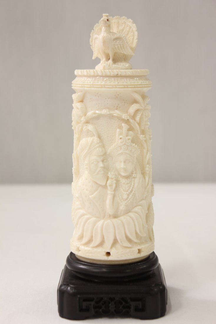 Islamic ivory carved box: Islamic ivory carved box with figure motif in relief with peacock motif final, 6.05"x2.1"dia