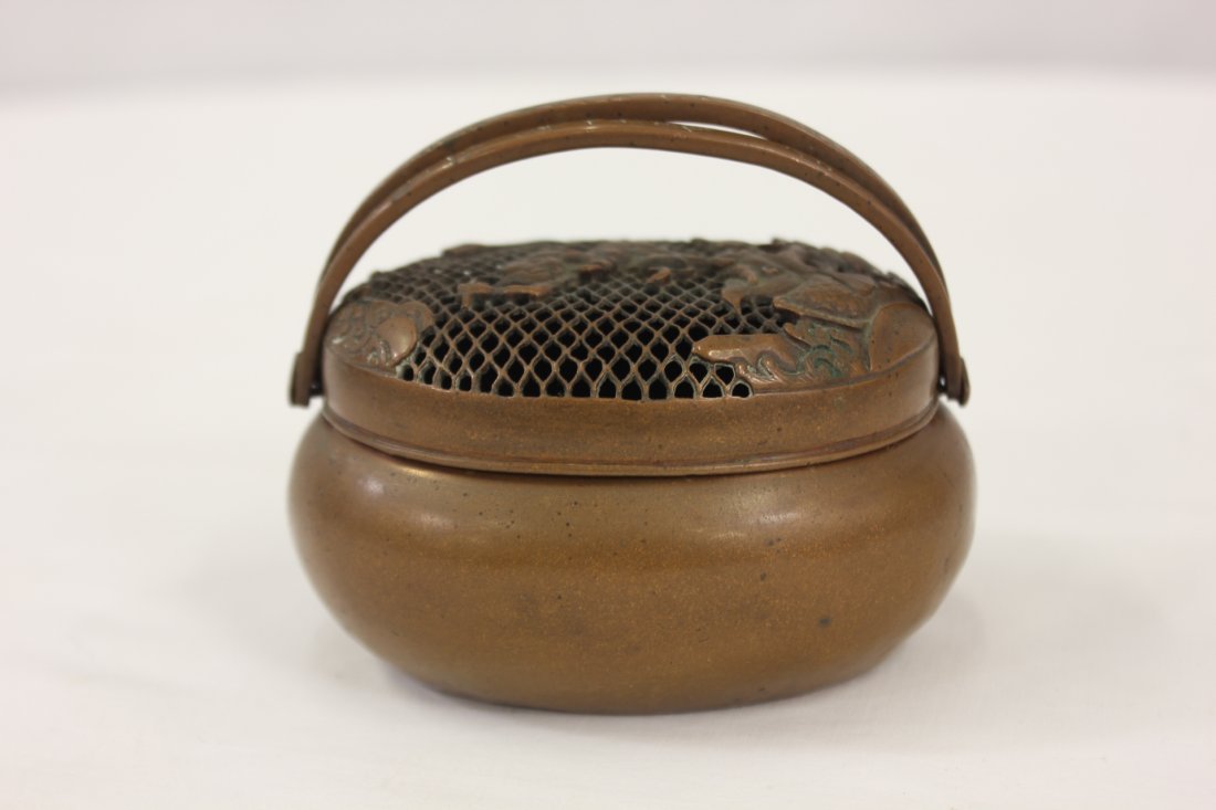 Chinese vintage bronze cricket box: Chinese vintage bronze cricket box, the top decorated with the fighting scene between Daoism god and dragon (bottom minor dent), 2.15"Hx3.65"x3"