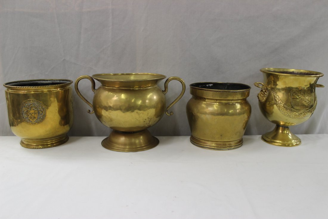 4pc English antique brass: 4pc English antique brass; a George III cache pot (7.5"Hx8.5"dia), a handled pot (8.5"Hx13.9"x9.25"), and 2 pots with family crest (7.75"Hx8.35"dia, 9.35"Hx9.1"x7.55")