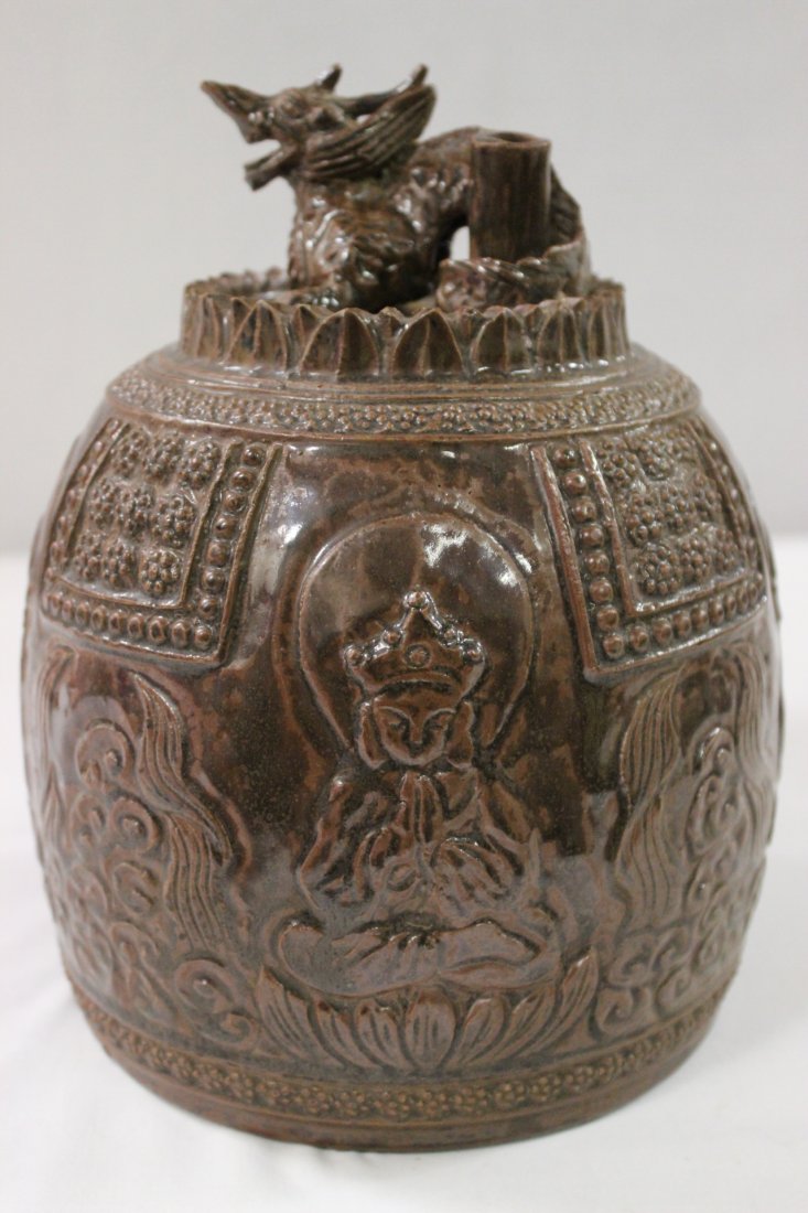 Antique Korean brown glazed censor cover(?): Antique Korean brown glazed censor cover(?) decorated with Buddha motif in relief (possible 16th/17th century), 8.85"Hx7.4"dia