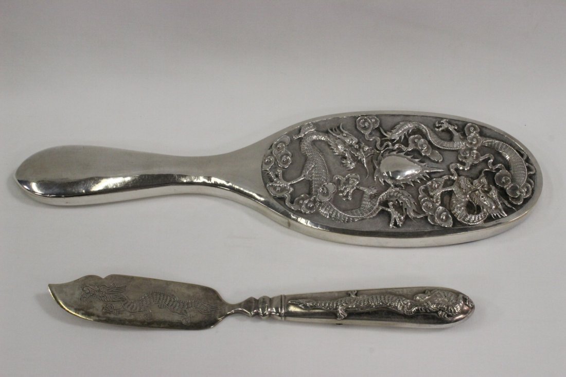 2 Chinese export silver pieces: 2 Chinese export silver pieces; a hand mirror (9.25"x2.8"x0.5") and a butter spread (6.7"L)