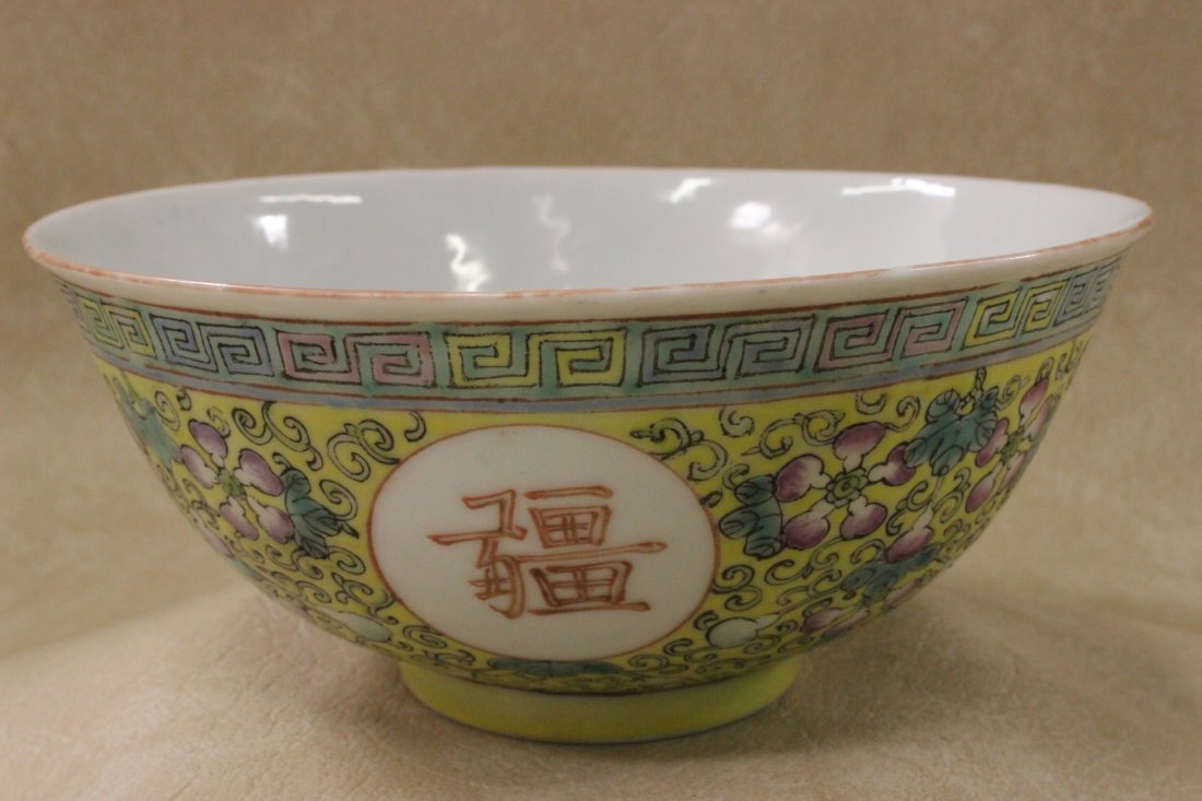 Chinese yellow background porcelain bowl: Chinese yellow background porcelain bowl, outside painted with flowers and calligraphy inside painted with bats, 2.9"Hx6.4"dia