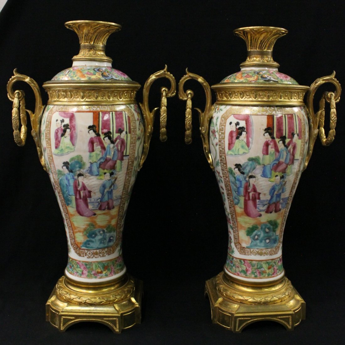 Pair Chinese famille rose porcelain covered vase: Pair Chinese famille rose porcelain covered vase painted with fairy tale scenes, enhanced with fancy gilt bronze ormolu (minor repair on one of the top rim), 15.25"Hx8.7"x5"