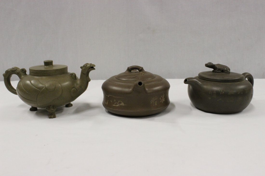 3 Yixing clay teapots: 3 Yixing clay teapots, 3.9"Hx7.5"x4.75", 3.5"Hx7.4"x5", 3.4"Hx7.7"x5.1"