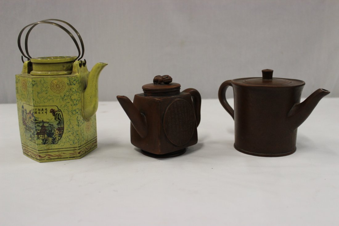 3 Yixing clay teapots: 3 Yixing clay teapots (one cover has chip), 5.35"Hx5"x4.1", 4.5"Hx7.2"x4.1", 4.25"Hx5.6'x3"
