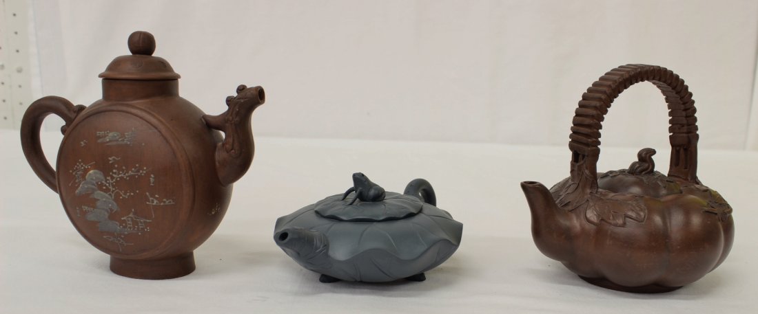 3 Chinese clay Yixing teapots: 3 Chinese clay Yixing teapots, 2.5"Hx6.4"x4.6", 5.75"Hx6.5"x2.75", 5.4"Hx6.4"x4.9"