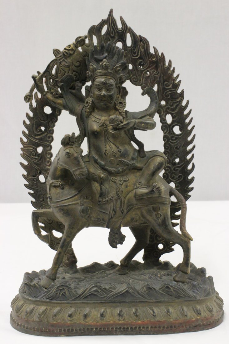 A bronze sculpture: A bronze sculpture depicting Buddha seating on horse, 12.5"Hx8.5"x3.5"