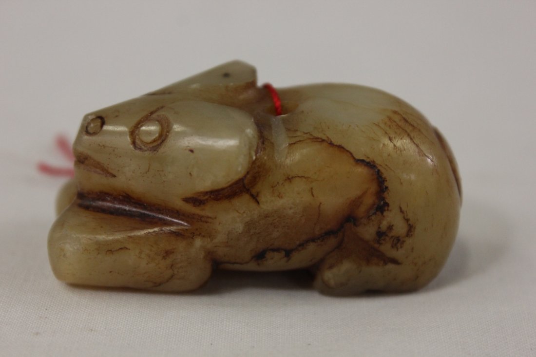 Chinese jade carved dog: Chinese jade carved dog (one ear back minor chip), 2"Lx0.9"x0.9"