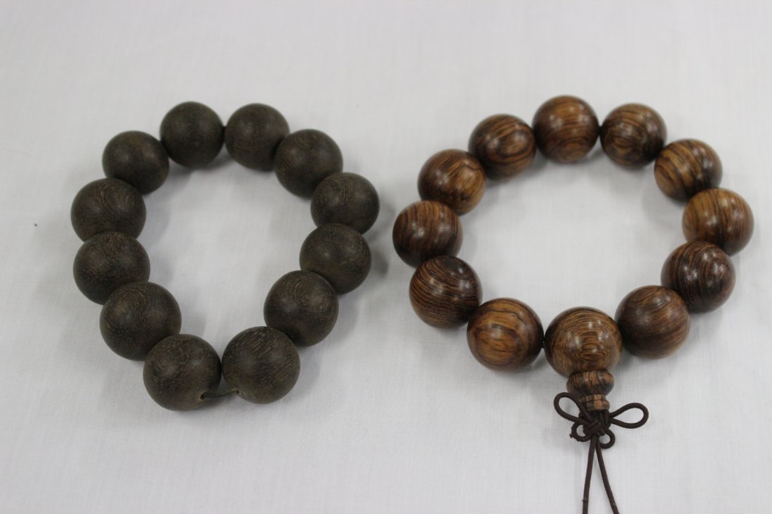 2 wood bead bracelets: One chenxiang wood (19.5mmm dia each x 12 beads) and one huanghuali wood (19mm dia each x 12 beads) bead bracelets