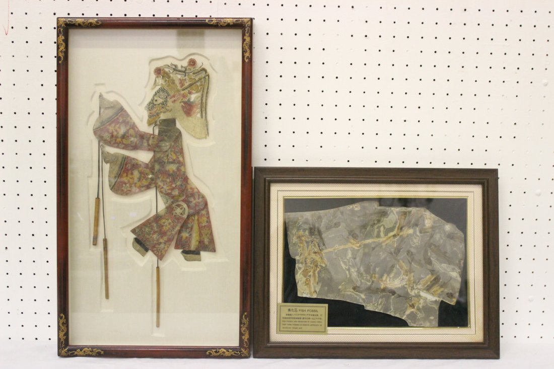 A framed fossil panel and a framed puppet: A framed fossil panel (8.75"x13") and a framed puppet (14"H)