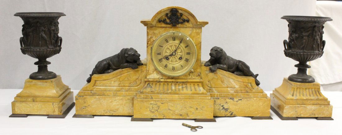 3pc French marble and bronze garniture set: An important 3pc French marble and bronze garniture set; the center clock (12.75"Hx23.15"x6.5") decorated with 2 tiger on side, the urns (12"Hx6.3"x6.3" each) decorated with fairy tale scene in relief