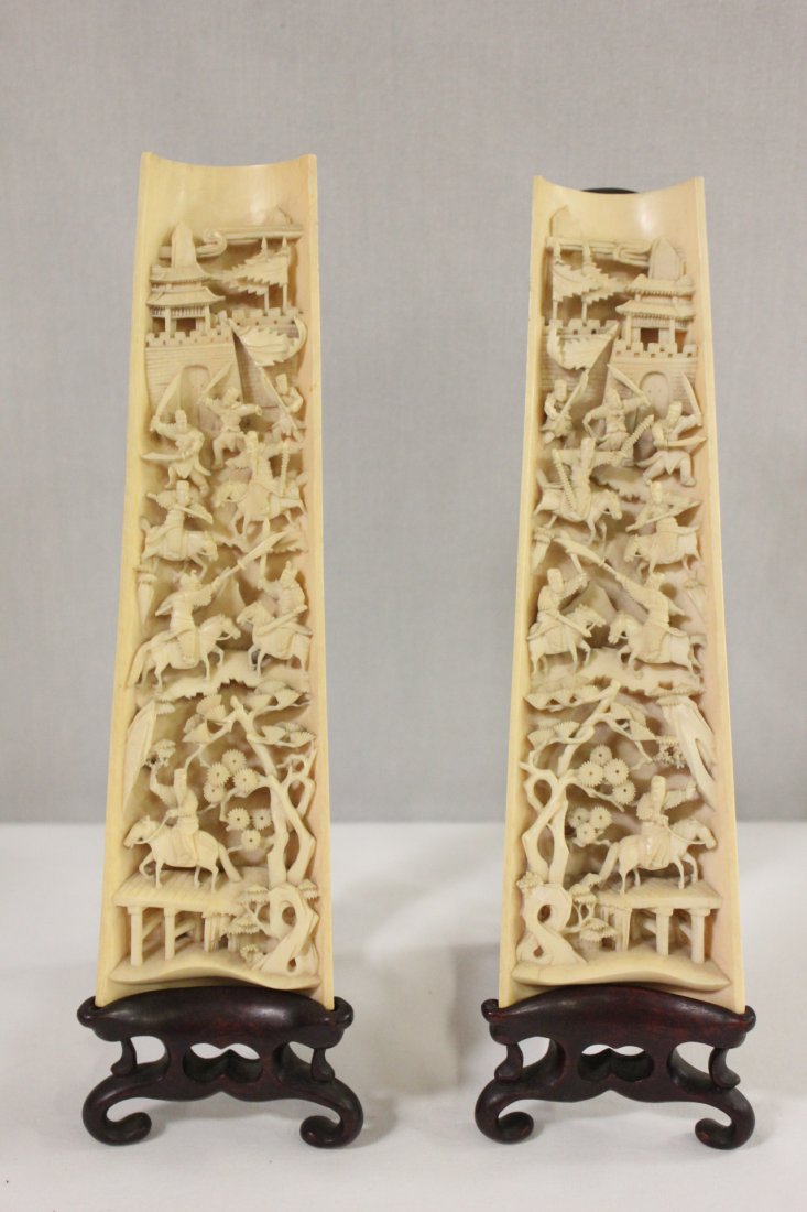 Pair fine Chinese antique ivory carved arm rest: Pair fine Chinese antique ivory carved arm rest (9.4"L each), one side carved with war scene, the other side carved with fairy tale scene in high relief