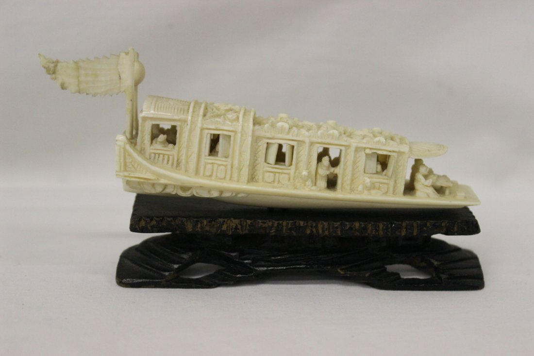 Chinese ivory carved boat: Chinese ivory carved boat with figures and operatable windows (repair on flag), 4.25"L