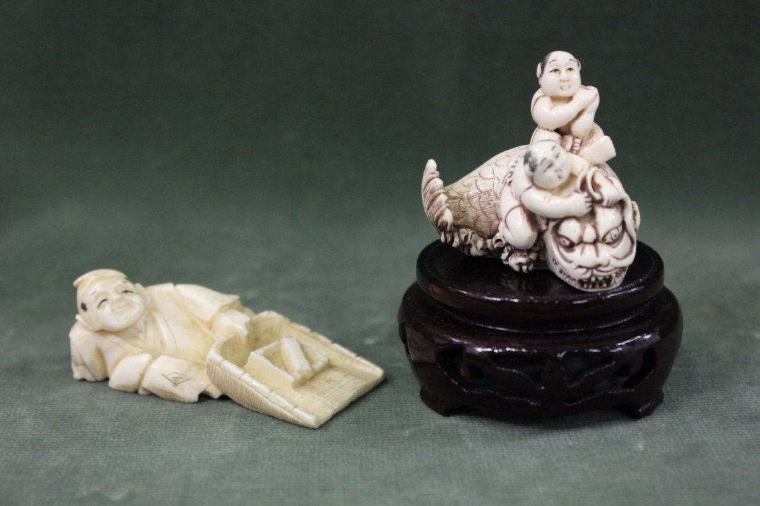 2 Japanese ivory carved netsuke: 2 Japanese ivory carved netsuke; man with dust pan (2.3"L) and 2 man fighting a monster fish (1.6"H)