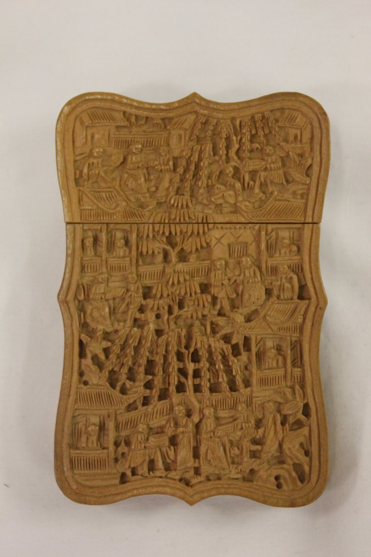 A Chinese sandalwood carved card box: A beautiful Chinese sandalwood carved card box (4.5"x3"x0.4") with canton work to depict figures and landscapes