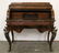 A French style mixed wood cylinder top desk