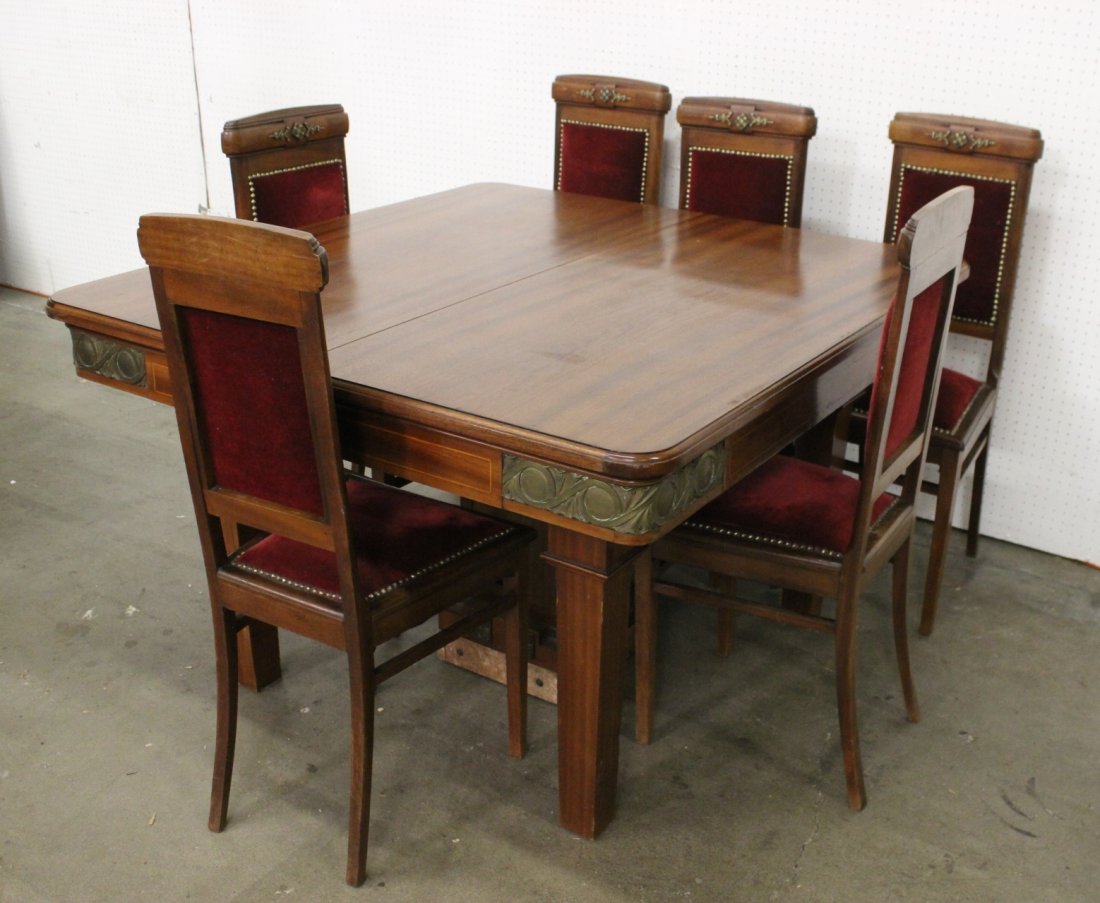 French mahogany table with 6 chairs: French mahogany table (32"Hx52.25"x89") with 2 extension boards and with 6 chairs (41.5"Hx17"x19" each) decorated with bronze ormolu