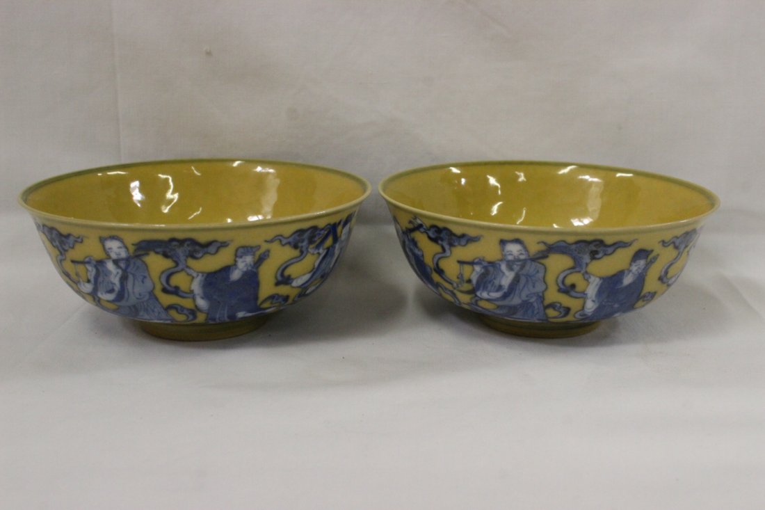 Pair Chinese yellow glazed porcelain bowls: Pair Chinese yellow glazed porcelain bowls (1.75"Hx4.35"dia each) painted with portraits of 8 Daoism gods