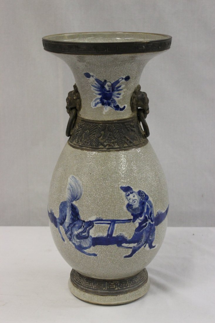 A Chinese antique crackle ware porcelain vase: A Chinese antique crackle ware porcelain vase (14.7"Hx6.9"dia) painted with fairy tale scene