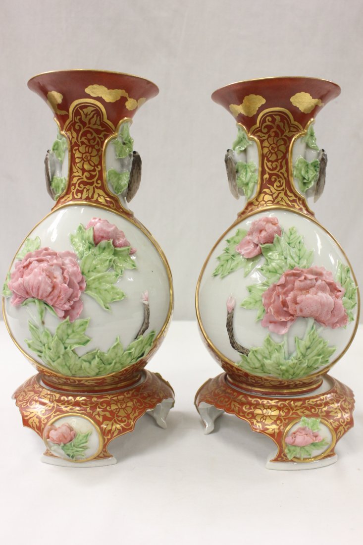 Pr signed important antique Japanese Kutani vases: Pair important antique Japanese Kutani porcelain vases depicting flowers in high relief, signed by artist, 12"Hx6"dia each