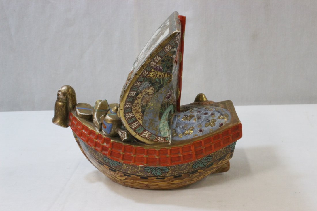 Japanese 19th century Kutani bowl, signed: A beautiful Japanese 19th century Kutani bowl (9.4"Hx10.25"x7")in sail boat motif, painted with phoenix and sea waves, signed by potter and artist