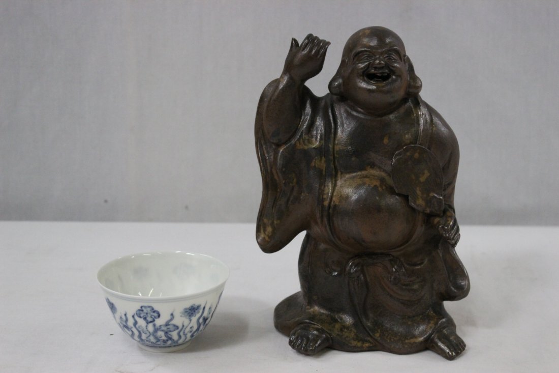 Chinese Yixing sculpture, and a Chinese b&w bowl: Chinese Yixing clay sculpture of monk (8.65"H), and a Chinese blue and white bowl (2"Hx3.55"dia)