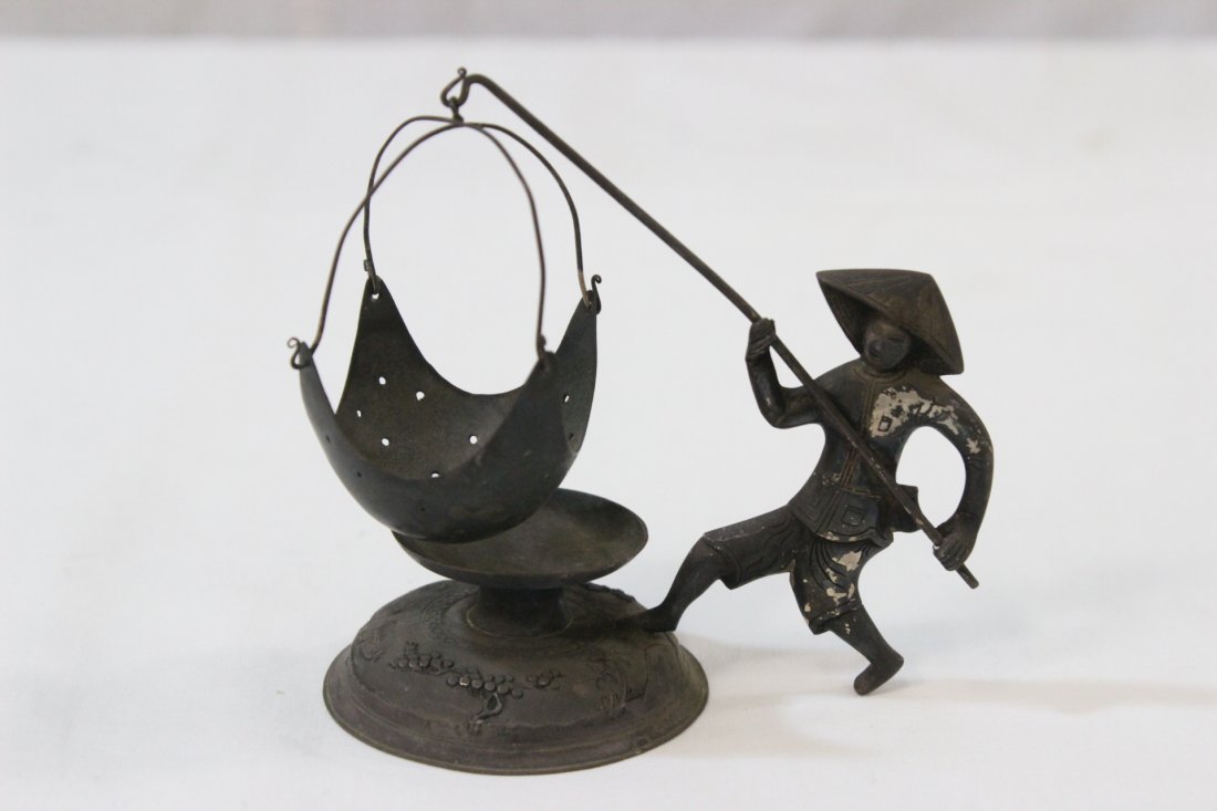 Vietnamese 900 silver table ornament: Vietnamese 900 silver table ornament (3.5"H) depicting fisherman with fishing net, wt. 58.5gm