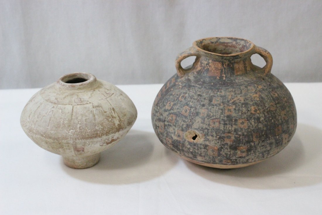 A Shang(?) pottery jar and an ancient pottery jar: A Shang(?) pottery jar (4.2"Hx5.2"dia) and an ancient pottery jar (hole) (5.5"Hx6.5"dia)
