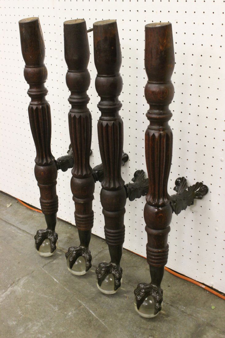 4 Victorian tiger oak table legs w/ cast iron claw foot: 4 Victorian tiger oak table legs (29"H each) with cast iron claw foot with glass balls