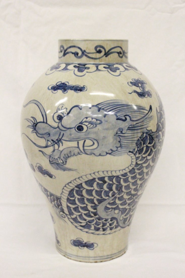 Korean blue and white porcelain vase: Korean blue and white porcelain vase painted with dragon (minor chip on top rim), 15.25"Hx10"dia