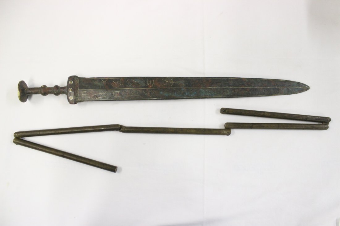 A bronze sword and a bronze martial art weapon: A bronze sword (21.4"L) and a bronze martial art weapon (40"L)