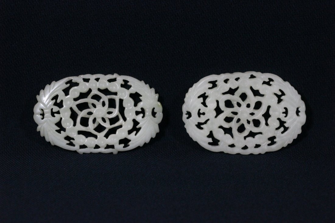 2 white jade carved oval ornaments: 2 white jade carved oval ornaments, 2.4"x1.5"x0.25", 2.3"x1.55"x0.3"