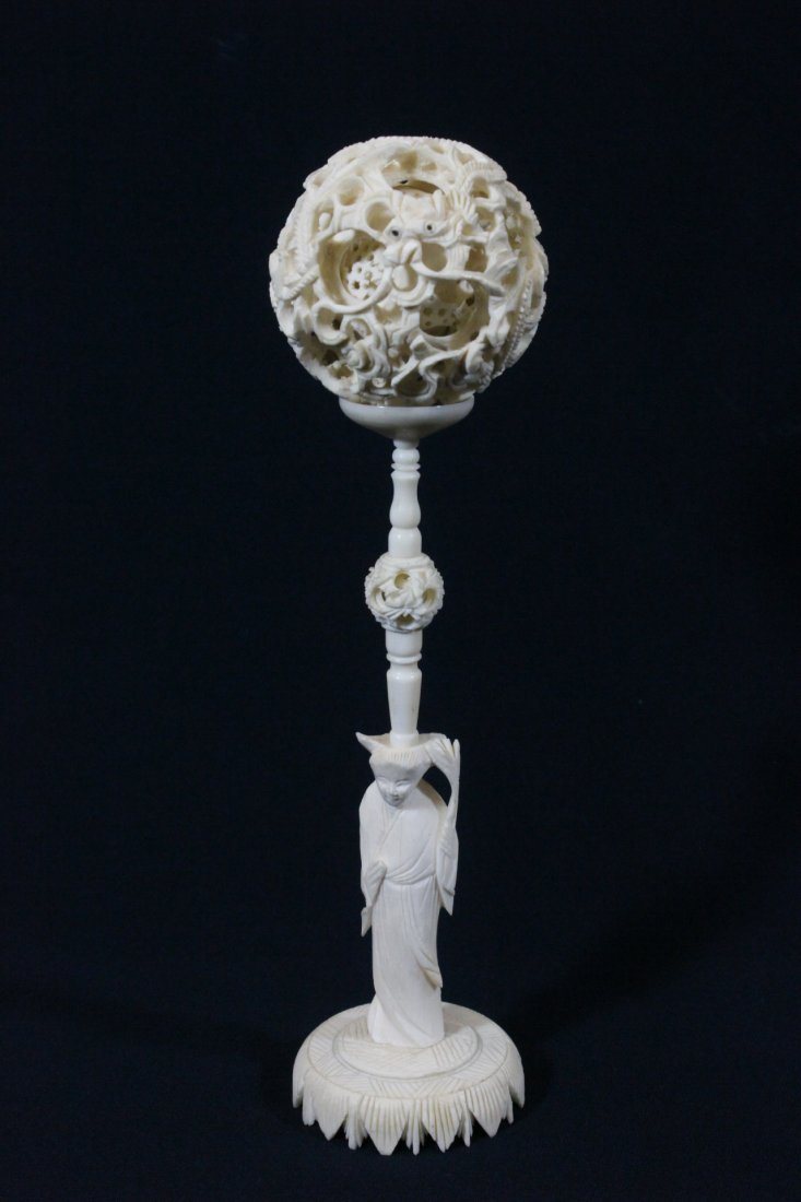 large Chinese ivory carved puzzle ball with stand: A large Chinese ivory carved puzzle ball (2.5"dia) with figural motif stand, 9.7"H, NO INTERNATIONAL SHIPPING OF IVORY