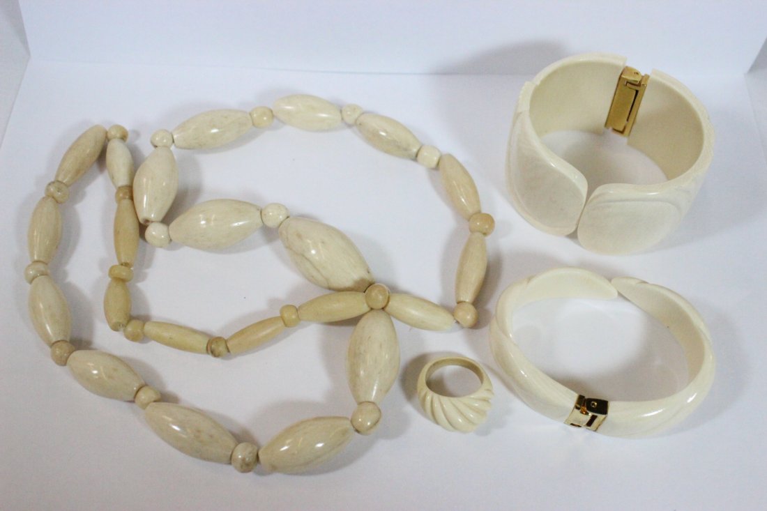 3 ivory pieces and a bone carved bead necklace: 2 ivory bracelets (2.6"x2.25"x1.5", 2.7"x2"x0.75"), an ivory ring (size 6.7) and a bone carved bead necklace (29"L), NO INTERNATIONAL SHIPPING OF IVORY