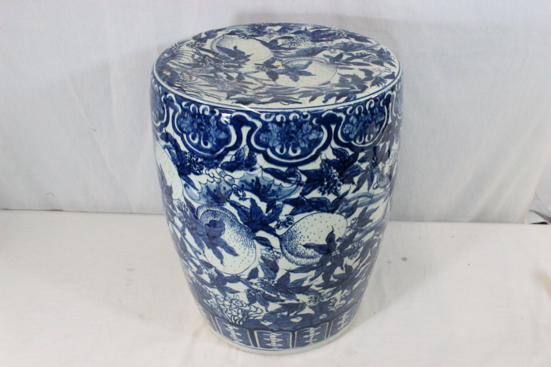 Chinese 19th/20th c. b&w porcelain garden stool: A fine Chinese 19th/20th century blue and white porcelain garden stool painted with peach branches, 19.2"Hx14.1"dia