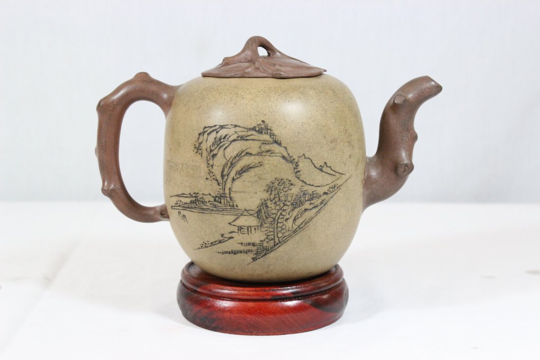 A fine 19th century Yixing teapot with calligraphy: A fine 19th century Yixing teapot (5.2"Hx7.7"x4.25") with calligraphy