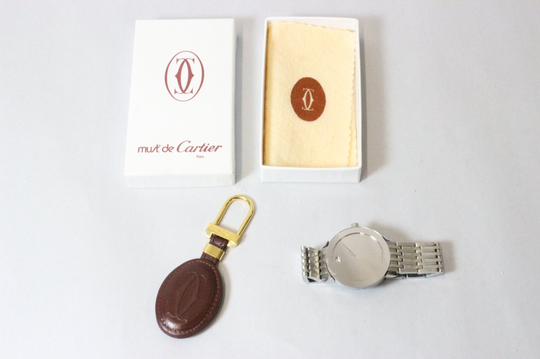 Cariter key holder & a Movado wrist watch: Cariter key holder with original box, and a Movado "concept 60" man's wrist watch (watch crystal edge damage)
