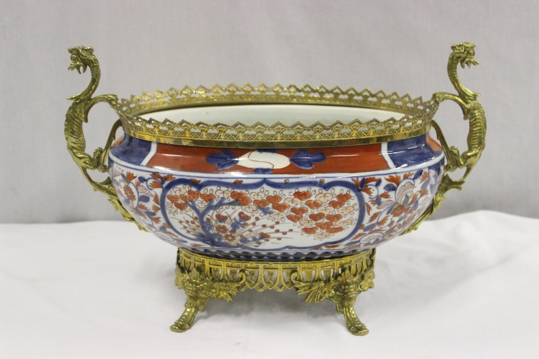 Japanese 18th/19th c. Imari bowl w/ bronze ormolu: A beautiful Japanese 18th/19th century Imari center bowl with bronze ormolu, qilin motif handles and winged dolphin feet, 10.8"Hx17.3"x9.5"