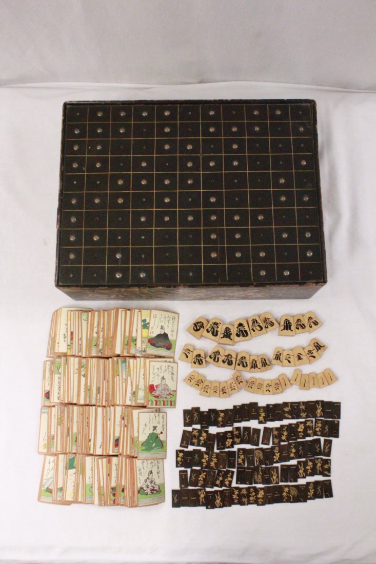 Japanese ant. lacquer chest w/ game cards and chips: Japanese antique lacquer game chest(?) (4.4"Hx14.9"x11.1") decorated with gold lacquer depicting flowers on all sides, also with game cards (2.7"x1.9" each) and game chips
