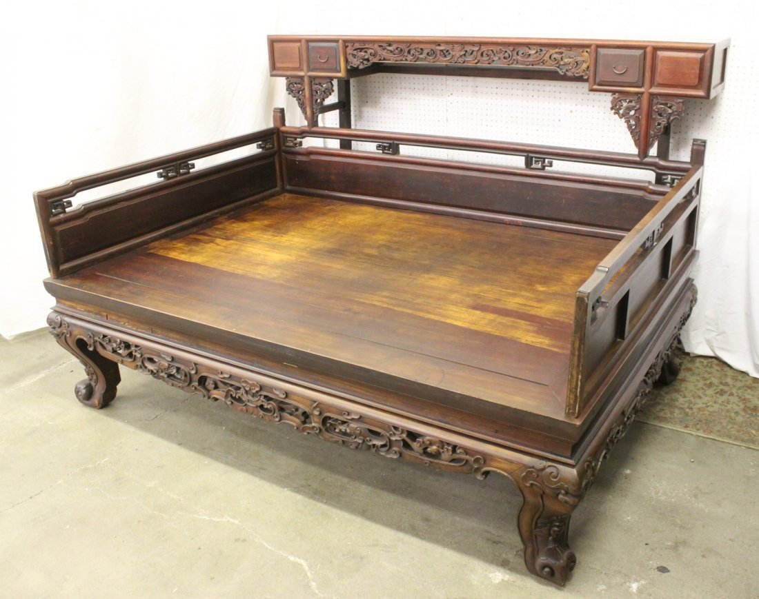Chinese 18th/19th century lohan bed: An important Chinese 18th/19th century rosewood lohan bed, the front carved with qilin motif, it also comes with back cabinet with drawers, 52"Hx84"x67"
