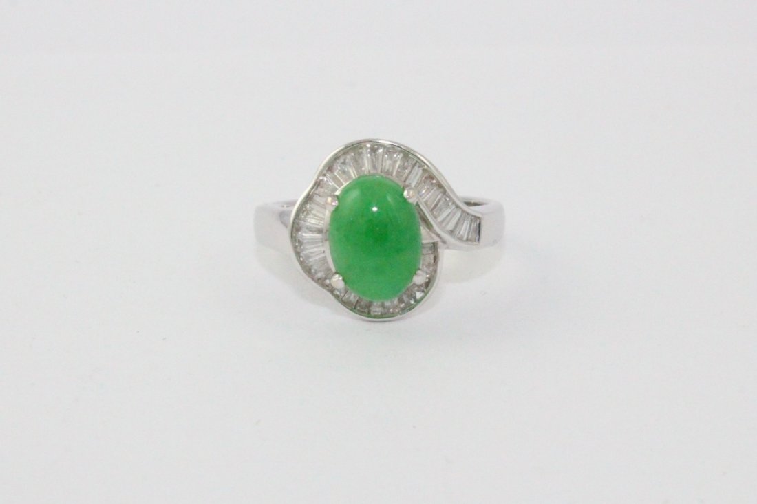 18K W/G jadeite diamond ring: A fine 18K W/G jadeite diamond ring, center apple green jadeite (9.3x6.9x4mm) surround by numerous baguettes, tdw approx. 1.2ct, wt. 5.2gm, size 6.5