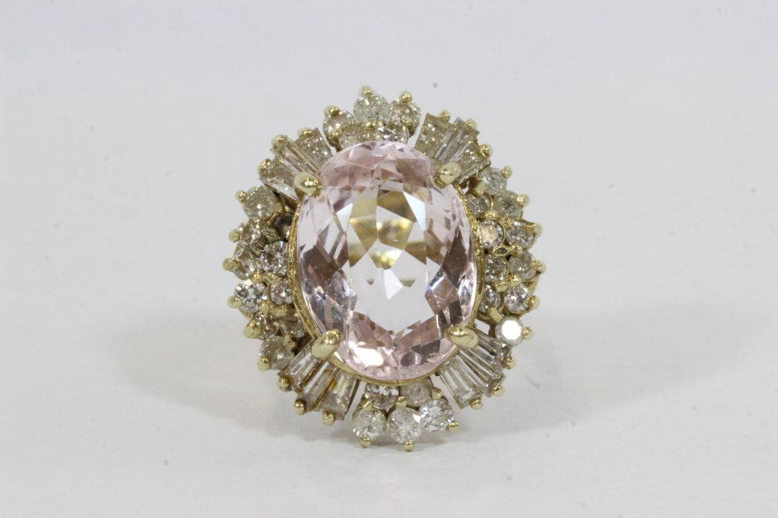 14K Y/G morganite diamond ring: 14K Y/G ring, center an oval cut morganite wt. approx. 6.80ct, accented by baguettes and round diamonds, tdw approx. 1.50ct, wt. 10.8gm, size 7 (International Auction Gallery does not guarantee the ac
