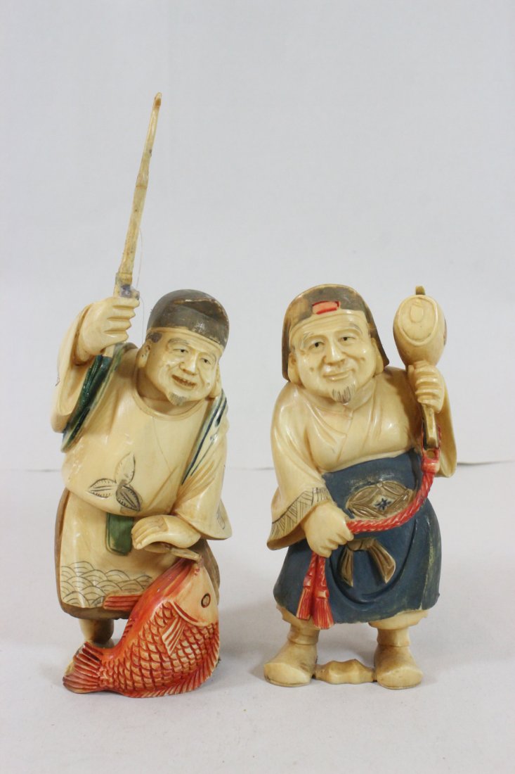 2 Japanese antique ivory carved okimono: 2 Japanese antique polychrome ivory carved okimono; one depicting fisherman (7.15"H), one as merchant (5.1"H), NO INTERNATIONAL SHIPPING OF IVORY