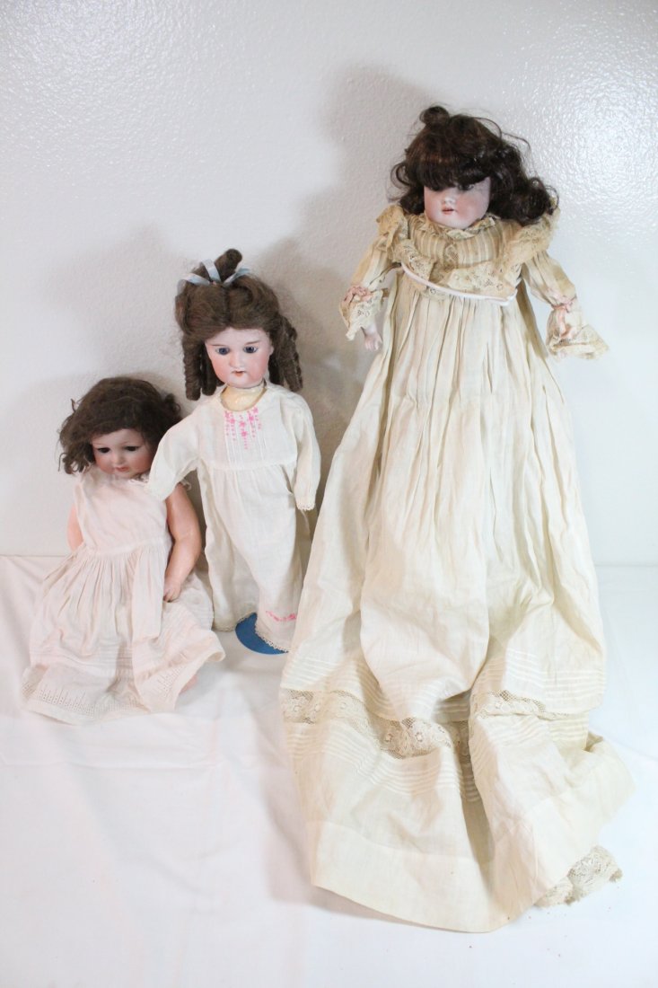 3 antique Germany antique bisque head dolls: 3 antique Germany antique bisque head dolls; AM 990 (repair on head) (18"), 1154 (18"), and Floradora (16.5")