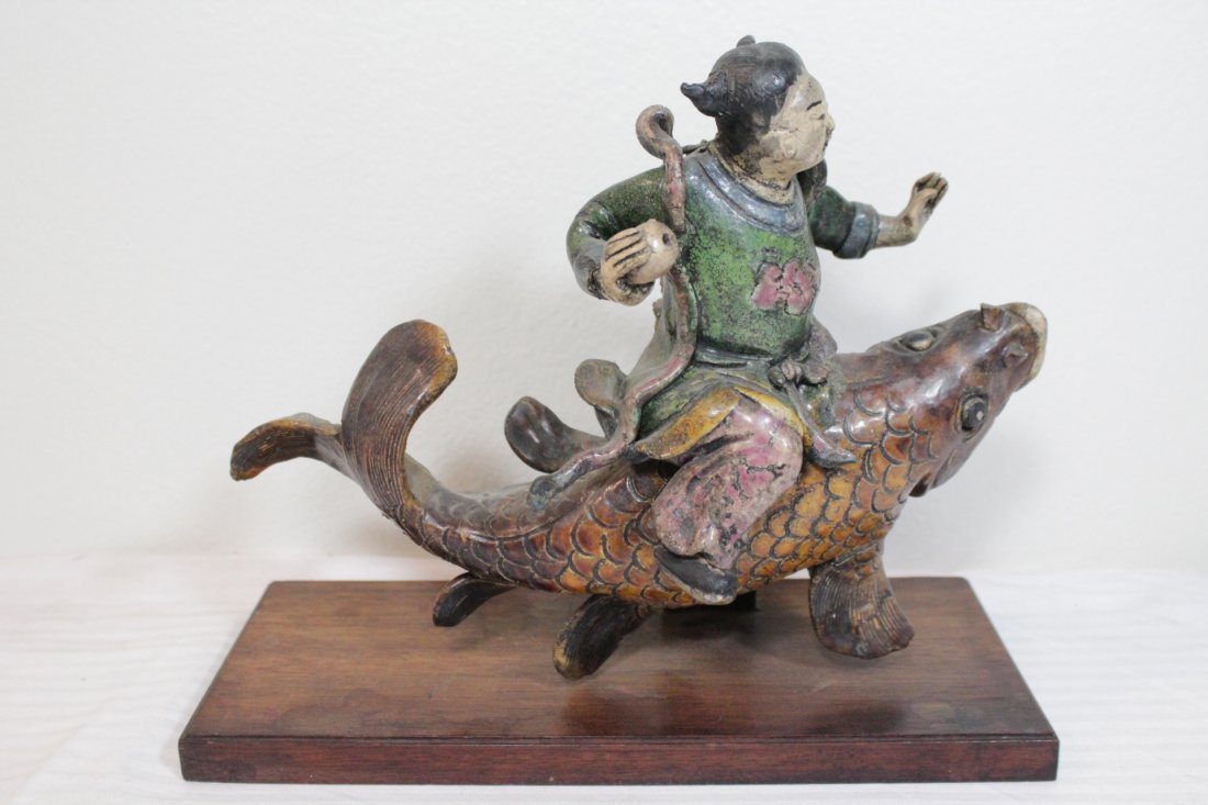Chinese vintage roof tile: Chinese vintage roof tile (8.75"H) depicting Daoism god riding on fish (fish front minor chip)