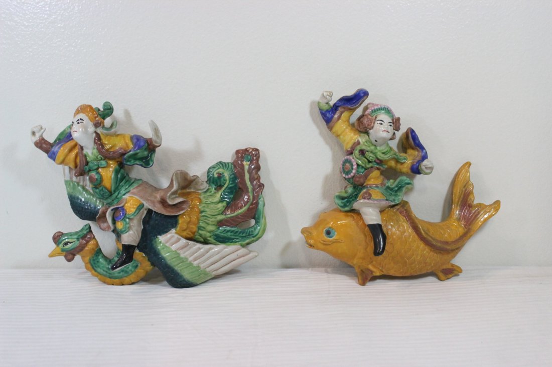 Pair Chinese roof tile: Pair Chinese roof tile (12.8"H, 11.5"H) depicting Daoism god riding on fish